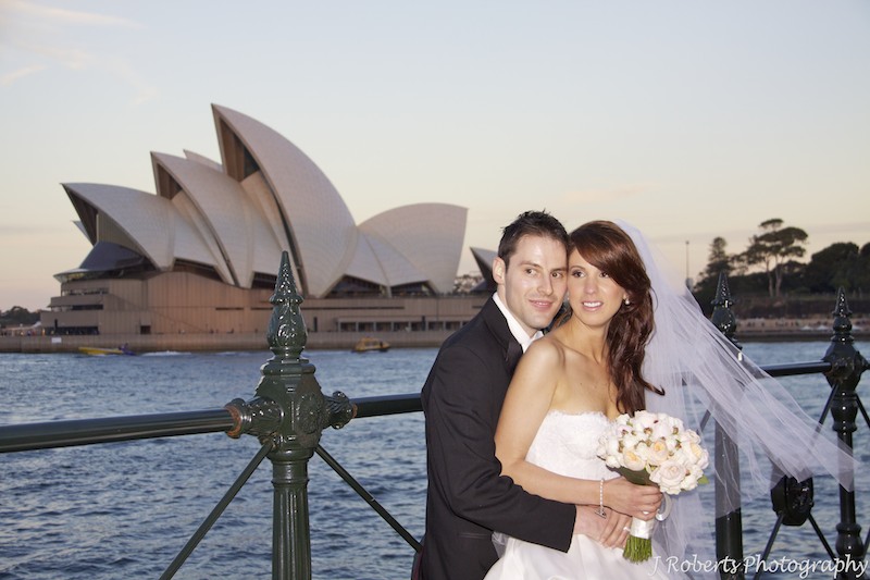Bride and groom at sunset with Sydney Opera House - wedding photography sydney